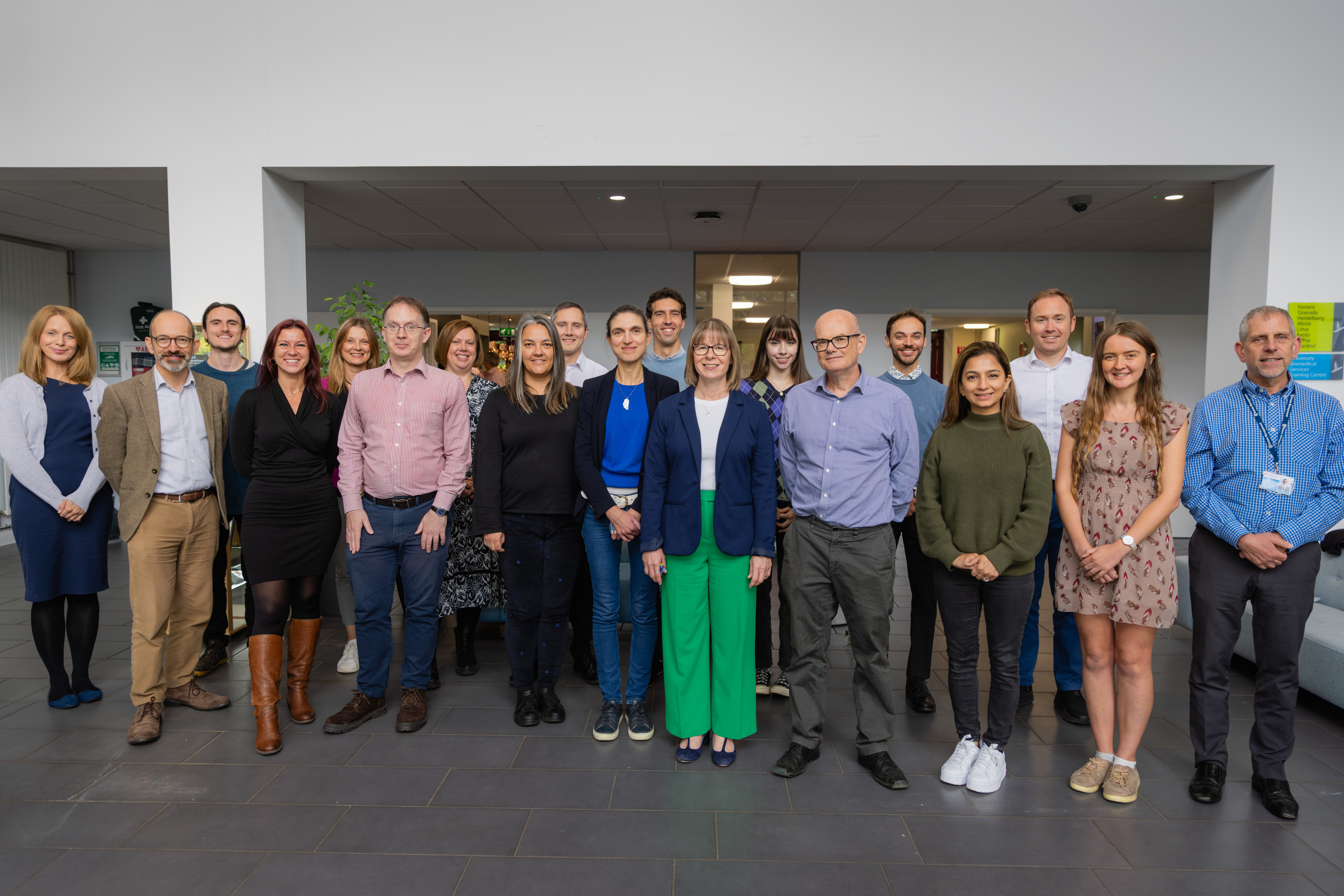 Group photo of the Environmental Sustainability Team, standing in a foyer.