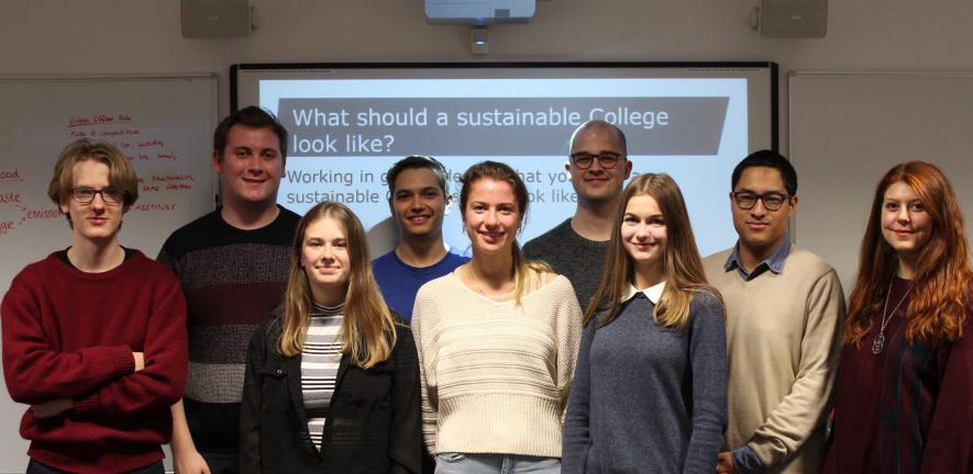 A group of students at a sustainability presentation. 