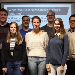 A group of students at a sustainability presentation. 